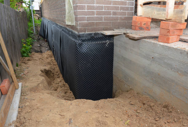 Happy homeowners after waterproofing job in Pinson